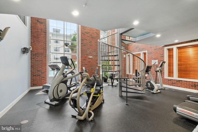 7 Booth St Unit 402, Gaithersburg, MD 20878 - gym featuring plenty of natural light, brick wall, and recessed lighting