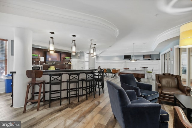 7 Booth St Unit 402, Gaithersburg, MD 20878 - living area with wood finished floors, crown molding, plenty of natural light, and a community bar