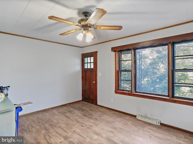 679 Winchester Grade Rd, Berkeley Springs, WV 25411 - entrance foyer featuring crown molding, wood finished floors, and ceiling fan
