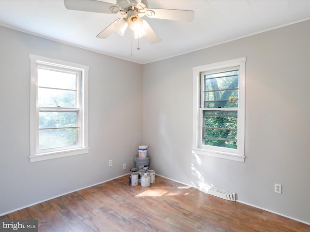 679 Winchester Grade Rd, Berkeley Springs, WV 25411 - spare room featuring wood finished floors, ceiling fan, and ornamental molding