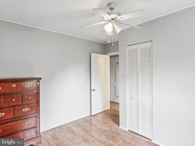 679 Winchester Grade Rd, Berkeley Springs, WV 25411 - unfurnished bedroom featuring light wood-style flooring, a closet, and ceiling fan