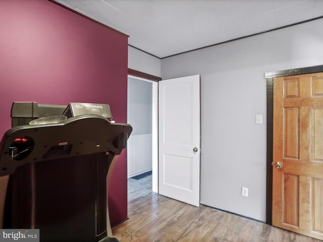 679 Winchester Grade Rd, Berkeley Springs, WV 25411 - bedroom featuring wood finished floors and wainscoting