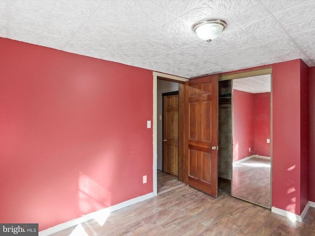 679 Winchester Grade Rd, Berkeley Springs, WV 25411 - unfurnished bedroom with wood finished floors and a closet