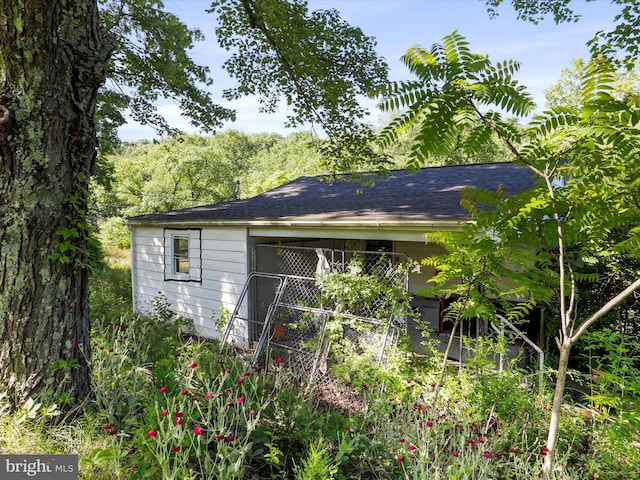 679 Winchester Grade Rd, Berkeley Springs, WV 25411 - view of home's exterior featuring a shingled roof
