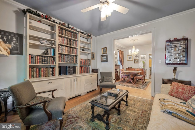 1117 S Carolina Ave SE, Washington, DC 20003 - living room featuring a chandelier, light wood finished floors, a ceiling fan, and ornamental molding