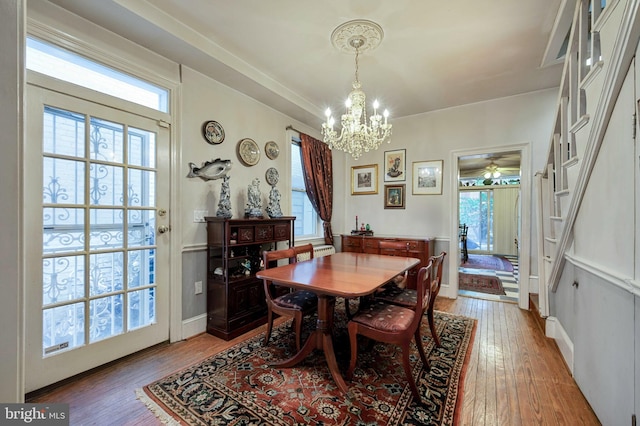 1117 S Carolina Ave SE, Washington, DC 20003 - dining area featuring a chandelier, light wood-type flooring, and plenty of natural light