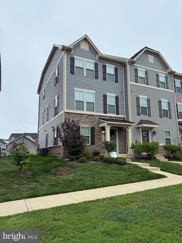 5824 Pecking Stone St, New Market, MD 21774 - view of front of house with a front yard and stone siding