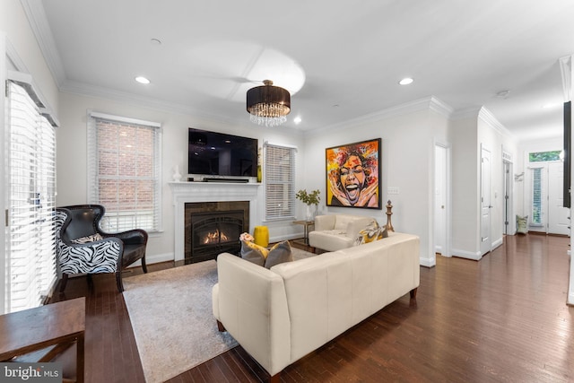 6006 New Hampshire Ave NE, Washington, DC 20011 - living room with recessed lighting, dark wood-style flooring, a glass covered fireplace, and ornamental molding