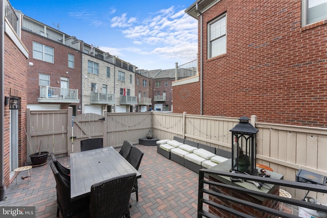 6006 New Hampshire Ave NE, Washington, DC 20011 - fenced backyard with a gate, a patio, outdoor dining space, outdoor lounge area, and a residential view
