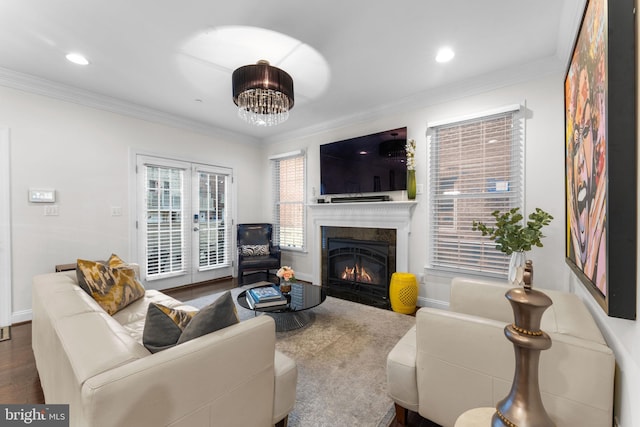 6006 New Hampshire Ave NE, Washington, DC 20011 - living room featuring a fireplace with flush hearth, crown molding, wood finished floors, recessed lighting, and a chandelier