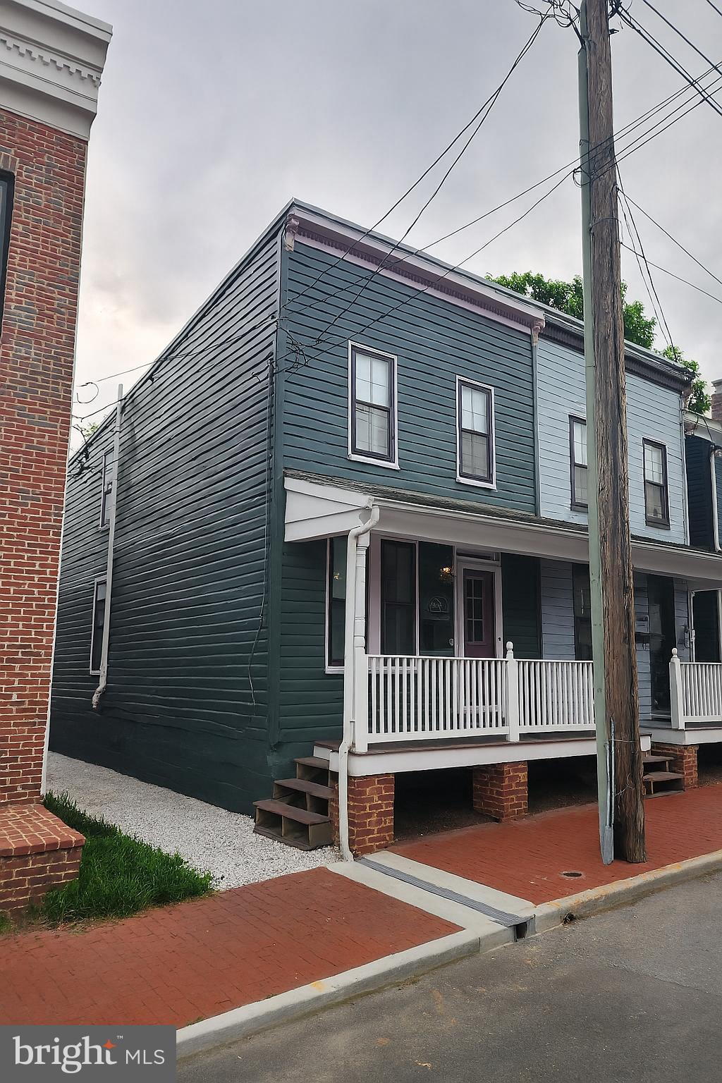 108 E 5th St, Frederick, MD 21701 - townhome / multi-family property with covered porch
