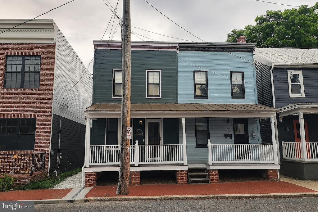 108 E 5th St, Frederick, MD 21701 - multi unit property featuring a porch, a standing seam roof, and a metal roof