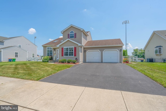 715 Dairy Dr, Middletown, DE 19709 - traditional-style home with an attached garage and asphalt driveway