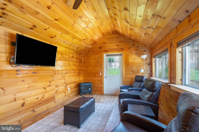 715 Dairy Dr, Middletown, DE 19709 - living area with a wood stove, wood finished floors, vaulted ceiling, wooden ceiling, and wooden walls