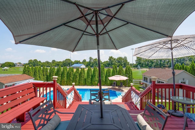 715 Dairy Dr, Middletown, DE 19709 - outdoor pool featuring outdoor dining space and a wooden deck