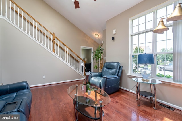 715 Dairy Dr, Middletown, DE 19709 - living area featuring a ceiling fan, stairs, wood finished floors, and vaulted ceiling