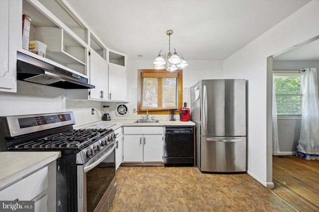 5614 Birch Ave, Pennsauken, NJ 08109 - kitchen with stainless steel appliances, under cabinet range hood, white cabinetry, light countertops, and a chandelier