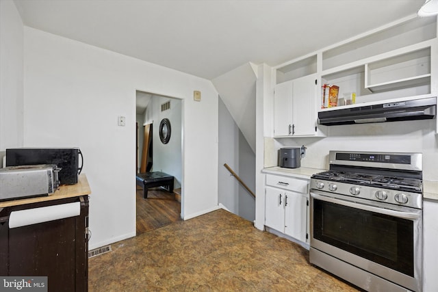 5614 Birch Ave, Pennsauken, NJ 08109 - kitchen featuring stainless steel range with gas cooktop, white cabinets, light countertops, under cabinet range hood, and open shelves
