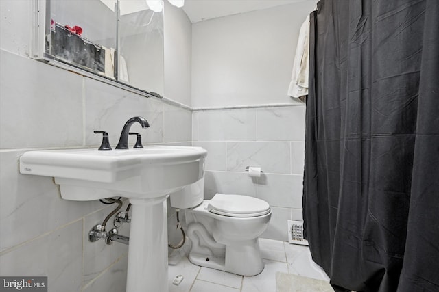 5614 Birch Ave, Pennsauken, NJ 08109 - full bath featuring tile walls, curtained shower, and marble look tile flooring