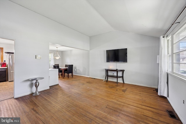 5614 Birch Ave, Pennsauken, NJ 08109 - living area with vaulted ceiling, plenty of natural light, and wood finished floors