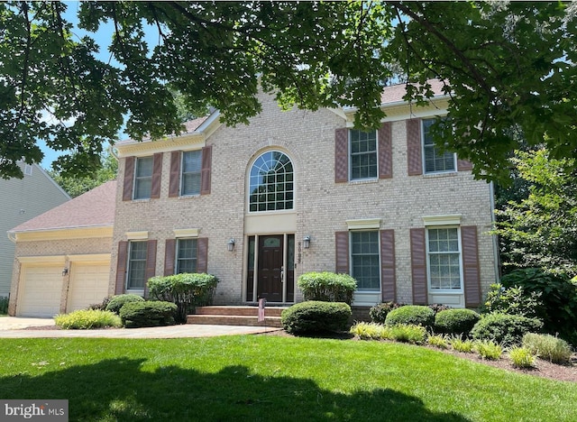 8008 Lions Crest Way, Gaithersburg, MD 20879 - colonial inspired home with an attached garage, a front lawn, and brick siding