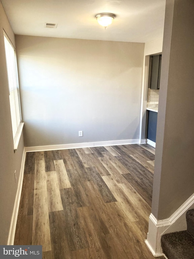 9969 Campus Way S Unit 139, Upper Marlboro, MD 20774 - spare room featuring dark wood-style floors and stairs