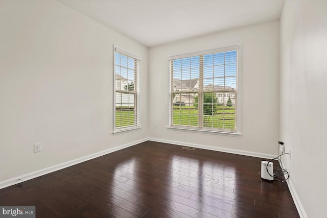 2602 Lady Grove Rd, Bowie, MD 20721 - spare room with baseboards and dark wood-type flooring