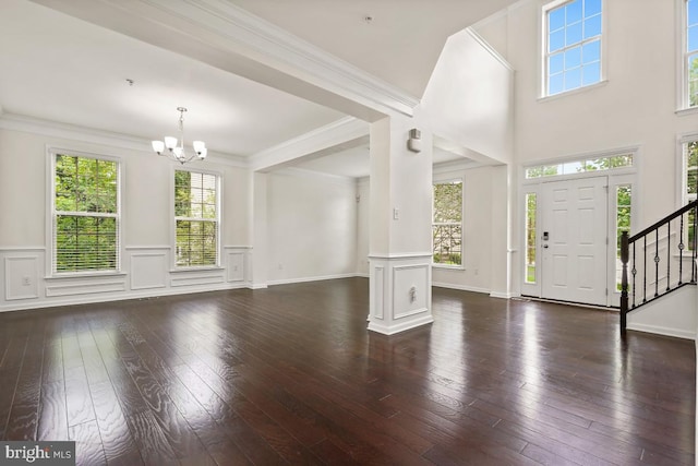 2602 Lady Grove Rd, Bowie, MD 20721 - foyer entrance with a chandelier, healthy amount of natural light, dark wood-type flooring, stairway, and wainscoting