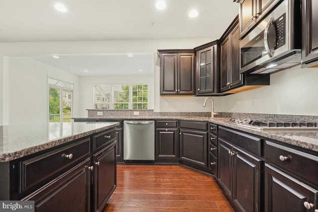 2602 Lady Grove Rd, Bowie, MD 20721 - kitchen with appliances with stainless steel finishes, plenty of natural light, dark wood finished floors, stone counters, and recessed lighting
