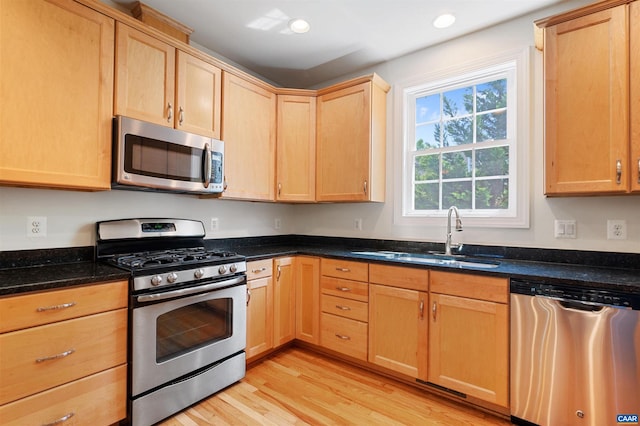 1614 Sawgrass Ct, Charlottesville, VA 22901 - kitchen featuring appliances with stainless steel finishes, light brown cabinetry, light wood-style flooring, dark stone counters, and recessed lighting