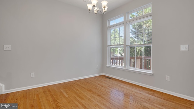 4724 Hanrahan Pl, Alexandria, VA 22309 - unfurnished room featuring a chandelier and wood finished floors