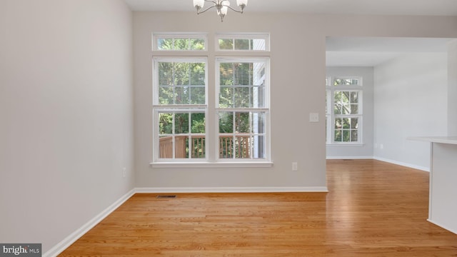 4724 Hanrahan Pl, Alexandria, VA 22309 - spare room with a chandelier and light wood-style flooring