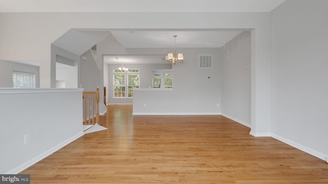 4724 Hanrahan Pl, Alexandria, VA 22309 - empty room featuring a chandelier and light wood finished floors