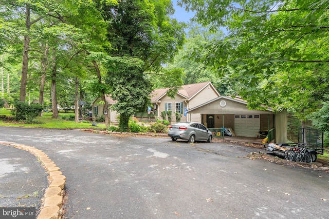590 Vaught Dr, Front Royal, VA 22630 - obstructed view of property featuring asphalt driveway and a garage
