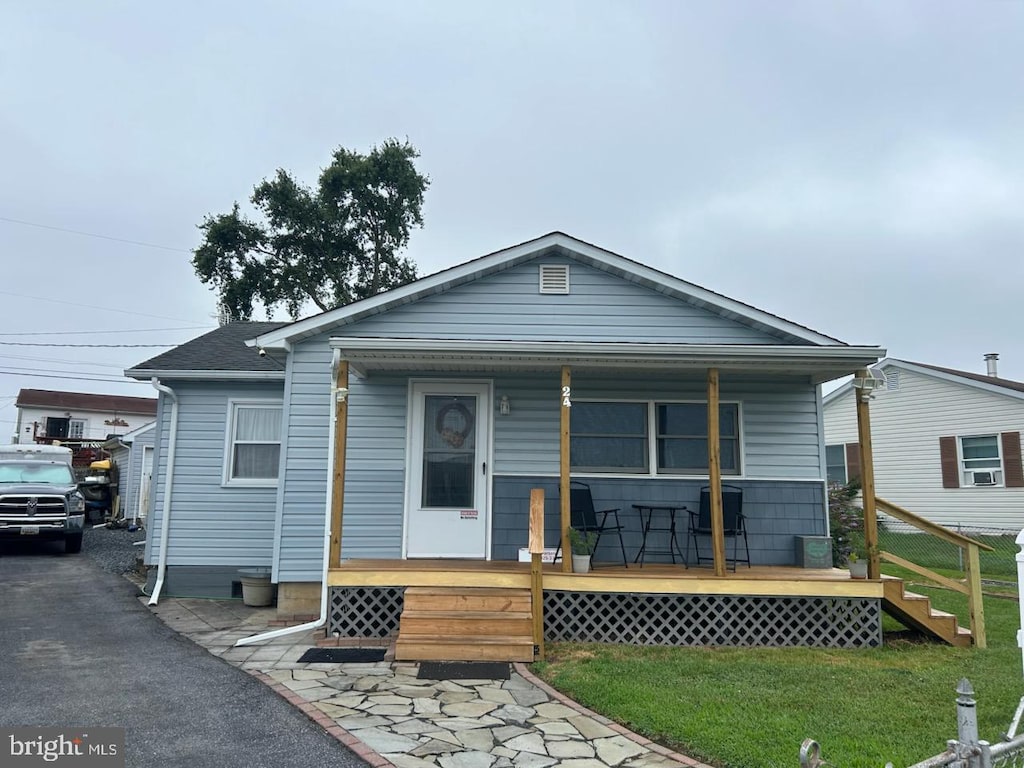 24 Gyro Dr, Baltimore, MD 21220 - rear view of property with a porch and a yard