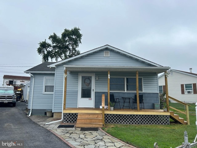 24 Gyro Dr, Baltimore, MD 21220 - rear view of property with a porch and a yard