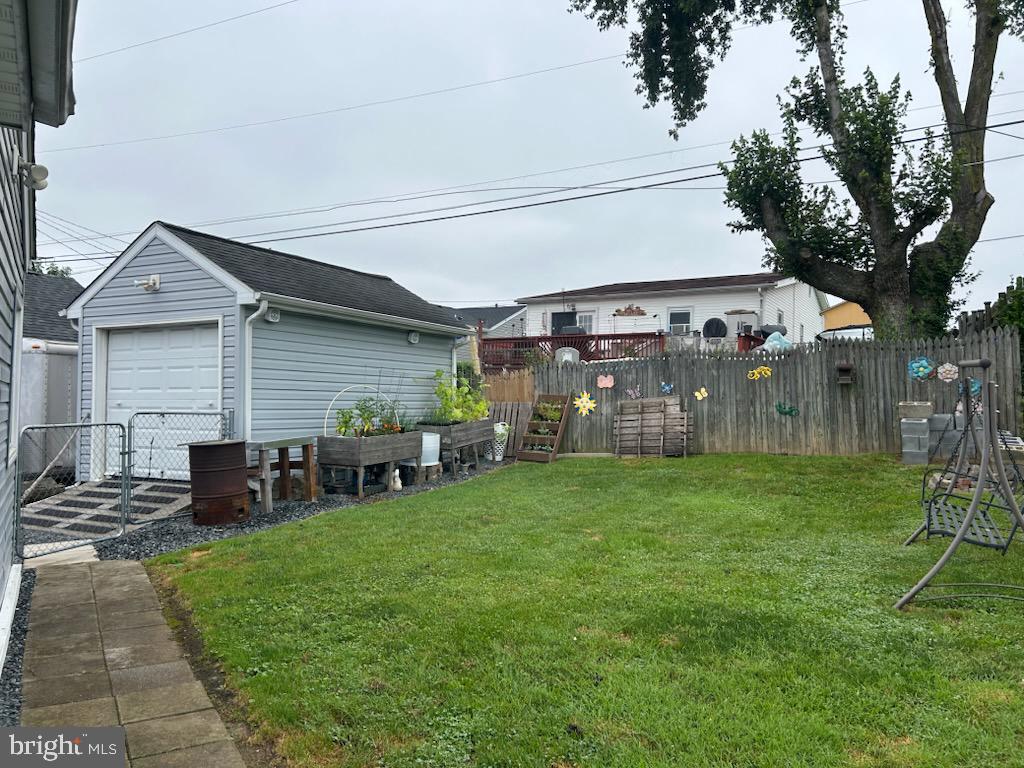 24 Gyro Dr, Baltimore, MD 21220 - view of yard featuring an outdoor structure and a detached garage