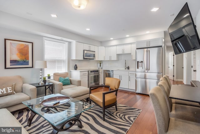 4106 Gault Pl NE Unit 3, Washington, DC 20019 - living area with dark wood finished floors and recessed lighting