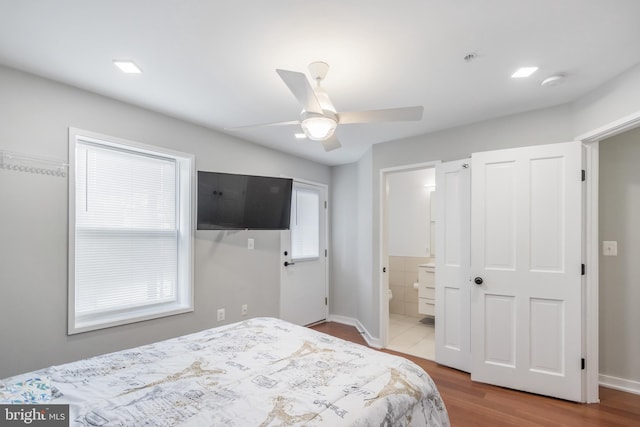 4106 Gault Pl NE Unit 3, Washington, DC 20019 - bedroom with wood finished floors, ensuite bath, and a ceiling fan