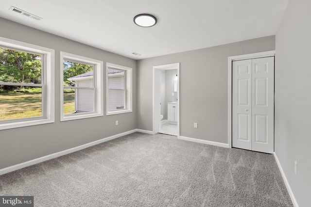 708 E Seminary, Towson, MD 21286 - unfurnished bedroom featuring carpet flooring, a closet, and ensuite bath
