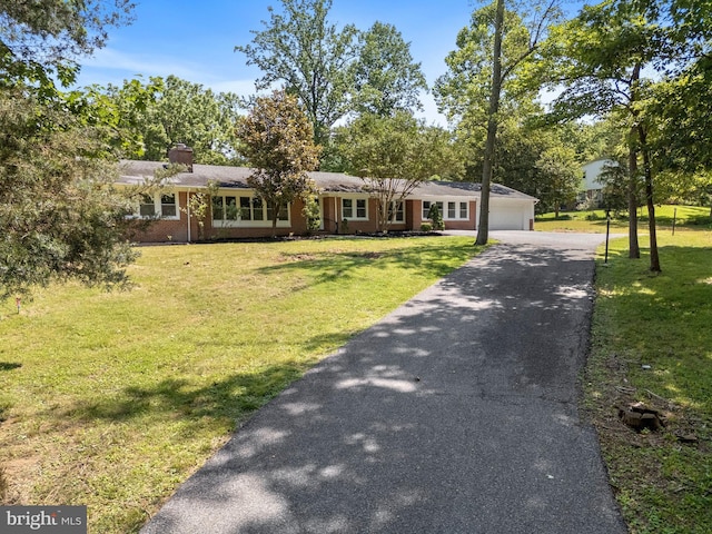708 E Seminary, Towson, MD 21286 - ranch-style home featuring a chimney, a garage, a front lawn, and driveway