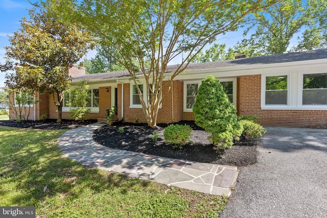 708 E Seminary, Towson, MD 21286 - ranch-style home featuring brick siding, a chimney, and a front yard