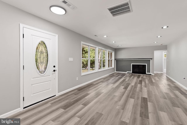 708 E Seminary, Towson, MD 21286 - entryway with light wood-type flooring, recessed lighting, and a glass covered fireplace