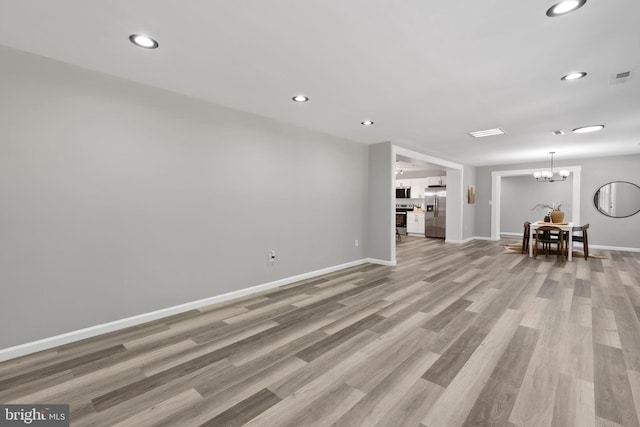708 E Seminary, Towson, MD 21286 - living area featuring light wood-style floors, recessed lighting, and a chandelier