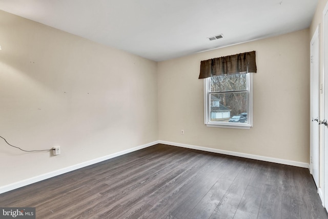 9216 Spring Acres Rd, Clinton, MD 20735 - spare room featuring baseboards and dark wood finished floors