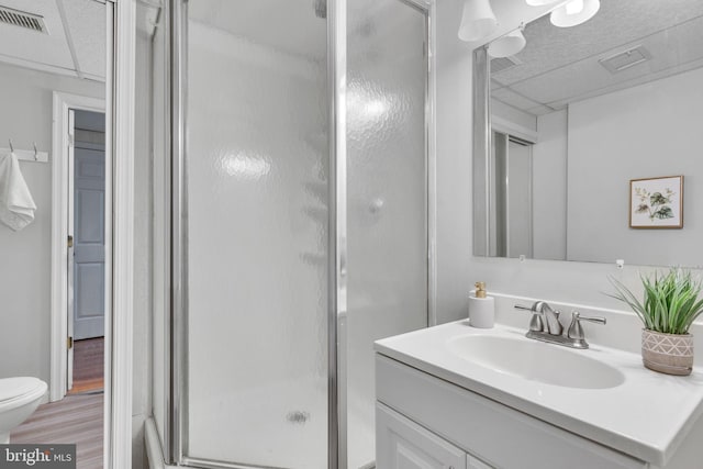 9216 Spring Acres Rd, Clinton, MD 20735 - bathroom featuring vanity, a stall shower, and wood finished floors