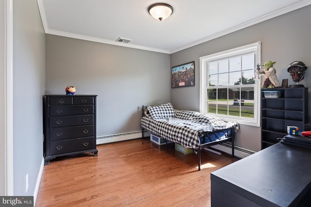 25 Tulip Ln, Levittown, PA 19054 - bedroom with baseboard heating, crown molding, and light wood-type flooring