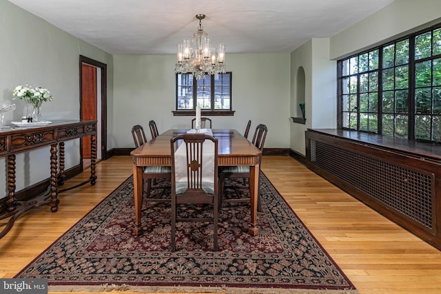 722 River Rd, Ewing, NJ 08628 - dining space with wood finished floors and a chandelier