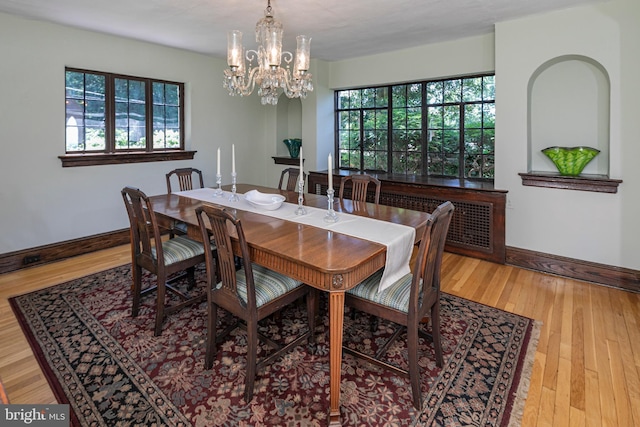 722 River Rd, Ewing, NJ 08628 - dining room with a chandelier, wood finished floors, and radiator heating unit