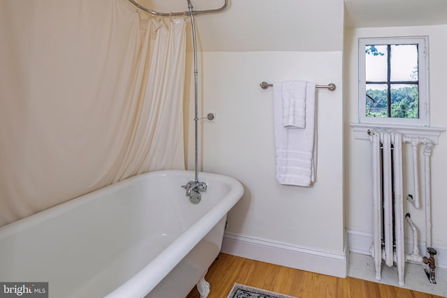 722 River Rd, Ewing, NJ 08628 - full bathroom with a soaking tub and wood finished floors
